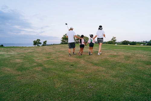 a family golfing